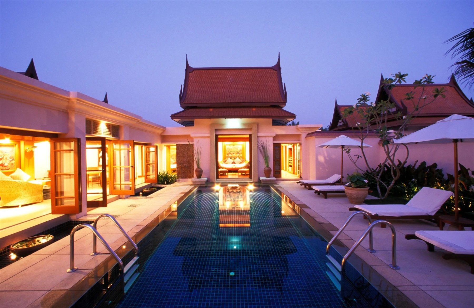 Luxury spa retreat with a pool at dusk